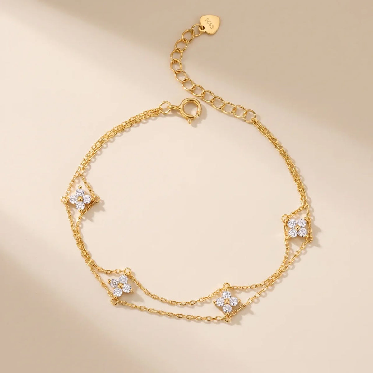 Gold-plated S925 sterling silver double-strand clover charm bracelet.