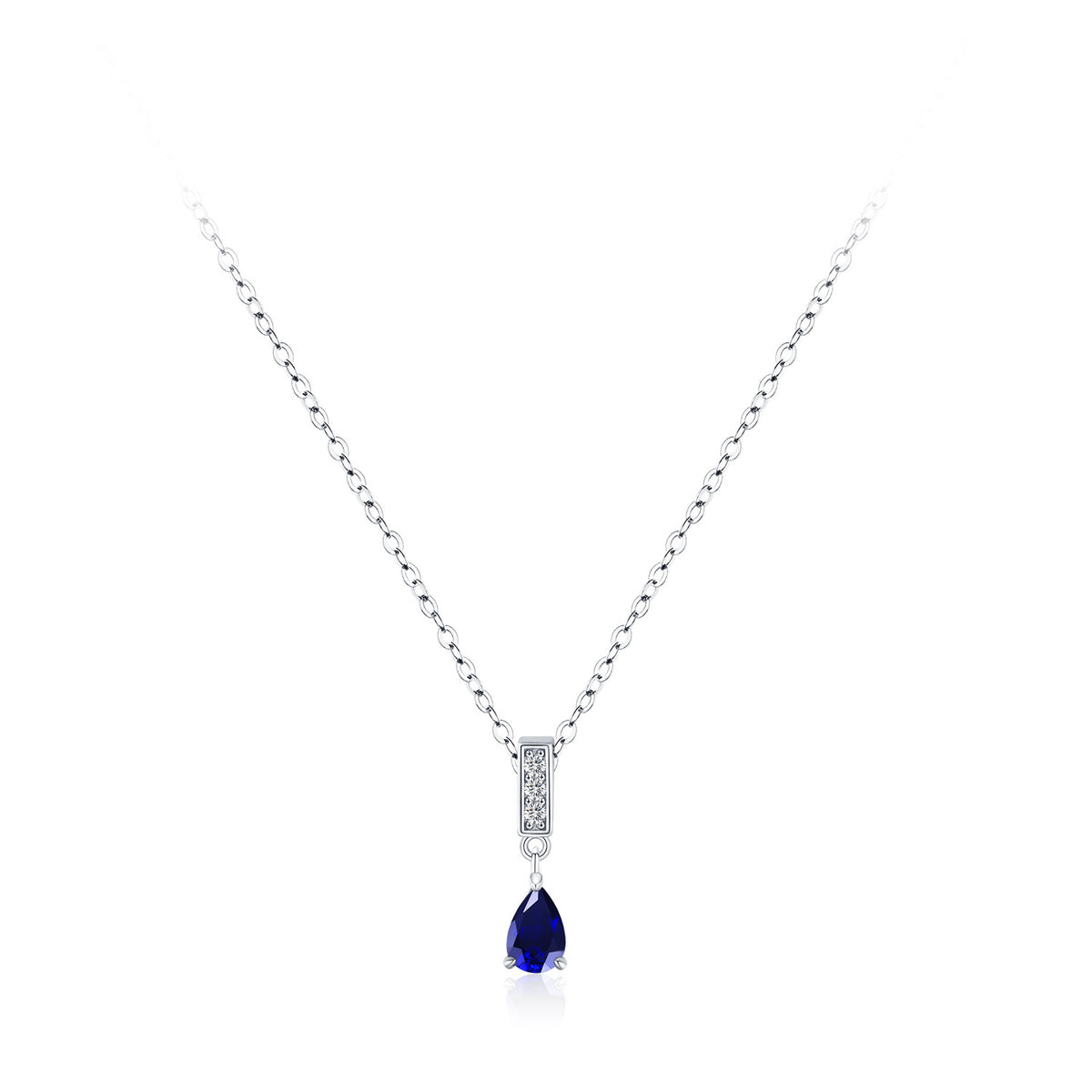 A silver chain necklace with a teardrop-shaped dark blue gemstone pendant, accented by a small rectangular silver bezel with tiny clear stones, shown on a plain white background.